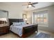 Main bedroom with ceiling fan, and a large window at 1782 Black Fox Canyon Rd, Henderson, NV 89052
