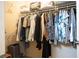 A walk-in closet with hanging storage and shelves that provide ample space for organizing clothing and accessories at 1782 Black Fox Canyon Rd, Henderson, NV 89052