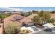 Featuring lush desert landscaping, this well-maintained home includes a stylish tile roof, and a three-car garage at 1963 Dakota Lodge Ave, Las Vegas, NV 89123