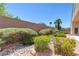 Well-maintained backyard with desert plants, a rock garden, and tall privacy fencing offering a private retreat at 1963 Dakota Lodge Ave, Las Vegas, NV 89123