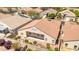 A backyard view of the home with a covered patio, tile roof, and landscaped yard at 1963 Dakota Lodge Ave, Las Vegas, NV 89123