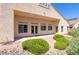 Backyard featuring desert-style landscaping, rock ground cover, and covered patio, designed for relaxation and outdoor living at 1963 Dakota Lodge Ave, Las Vegas, NV 89123