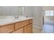 Bright bathroom with a single vanity and attached bedroom at 1963 Dakota Lodge Ave, Las Vegas, NV 89123