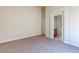 Spacious bedroom boasts neutral carpet and leads to an en-suite bathroom, offering comfort and convenience at 1963 Dakota Lodge Ave, Las Vegas, NV 89123