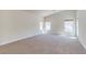 Spacious primary bedroom featuring neutral carpet, paint and plenty of natural light at 1963 Dakota Lodge Ave, Las Vegas, NV 89123
