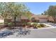 Inviting single-story residence with desert landscaping, a tile roof, and an attached two-car garage at 1963 Dakota Lodge Ave, Las Vegas, NV 89123