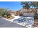 Charming single-story home with tile roof, desert landscaping, and a spacious three-car garage at 1963 Dakota Lodge Ave, Las Vegas, NV 89123