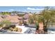 Charming two-story home with a well-maintained lawn, desert landscaping, and tile roof at 1963 Dakota Lodge Ave, Las Vegas, NV 89123