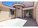 Welcoming front entrance with courtyard, stucco walls, and a covered entryway at 1963 Dakota Lodge Ave, Las Vegas, NV 89123
