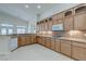 Wooden cabinets, granite countertops and modern appliances enhance this bright kitchen at 1963 Dakota Lodge Ave, Las Vegas, NV 89123