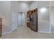 Kitchen featuring stainless steel refrigerator, granite countertops, and wooden cabinets at 1963 Dakota Lodge Ave, Las Vegas, NV 89123