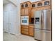 Kitchen featuring stainless appliances, wood cabinets and granite counters at 1963 Dakota Lodge Ave, Las Vegas, NV 89123