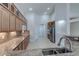 Spacious kitchen with granite countertops, wooden cabinets, and stainless-steel appliances at 1963 Dakota Lodge Ave, Las Vegas, NV 89123