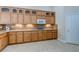 Kitchen with wood cabinets, granite countertops and modern appliances at 1963 Dakota Lodge Ave, Las Vegas, NV 89123