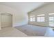Spacious living room with carpet and tile flooring, plus large windows for natural light at 1963 Dakota Lodge Ave, Las Vegas, NV 89123
