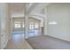 Open concept living space with high ceilings, neutral carpet, and lots of natural light at 1963 Dakota Lodge Ave, Las Vegas, NV 89123