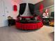 Unique bedroom featuring a round bed with dramatic black and red decor at 212 Orland St # 22, Las Vegas, NV 89107