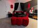 Gothic bedroom features a round bed with red accents and black and white accents at 212 Orland St # 22, Las Vegas, NV 89107