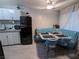 Kitchenette and dining area with a vintage-style refrigerator, complete with a cozy dining set at 212 Orland St # 22, Las Vegas, NV 89107