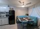 Charming dining area with a booth-style seating, retro refrigerator, and bright natural light at 212 Orland St # 22, Las Vegas, NV 89107
