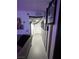 Hallway with striped walls and decor leading to a door at the end at 212 Orland St # 22, Las Vegas, NV 89107
