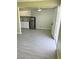 Open-concept area showcasing the modern kitchen, complete with gray flooring and stainless-steel refrigerator at 212 Orland St # 22, Las Vegas, NV 89107