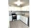 Updated kitchen featuring white cabinets, stainless steel appliances, and granite countertops at 212 Orland St # 22, Las Vegas, NV 89107