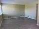 Spacious, light-filled room with wood-look flooring and neutral wall color at 212 Orland St # 22, Las Vegas, NV 89107