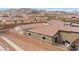 A home backyard featuring a stucco wall, patio, and pergola with a view of the surrounding neighborhood at 2213 Chandler Ranch Pl, Laughlin, NV 89029