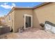 Exterior view of the back of home with paver patio at 2213 Chandler Ranch Pl, Laughlin, NV 89029