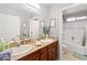 Bathroom featuring double sinks, granite countertops, and neutral decor at 2213 Chandler Ranch Pl, Laughlin, NV 89029