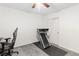 Bright room featuring a treadmill, plush carpet, and a ceiling fan at 2213 Chandler Ranch Pl, Laughlin, NV 89029