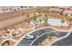 Birds eye view of community amenities including a pool, park, parking, and desert landscaping at 2213 Chandler Ranch Pl, Laughlin, NV 89029