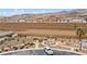 Aerial view of community park featuring ramadas, picnic tables, trees, walking path and desert landscaping at 2213 Chandler Ranch Pl, Laughlin, NV 89029