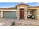 Charming home featuring a well-maintained lawn and a cozy porch perfect for relaxation at 2213 Chandler Ranch Pl, Laughlin, NV 89029