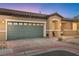Inviting home featuring a neatly kept yard, charming curb appeal, and a convenient two-car garage at 2213 Chandler Ranch Pl, Laughlin, NV 89029