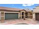 Charming home featuring a lush, landscaped yard and a two-car garage at 2213 Chandler Ranch Pl, Laughlin, NV 89029