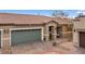 Charming home featuring a lush, landscaped yard and a two-car garage at 2213 Chandler Ranch Pl, Laughlin, NV 89029