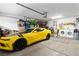 Spacious garage with a yellow sports car and ample storage solutions at 2213 Chandler Ranch Pl, Laughlin, NV 89029