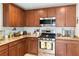 Modern kitchen with granite countertops, stainless steel appliances, and stylish cabinetry at 2213 Chandler Ranch Pl, Laughlin, NV 89029