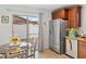 Eat-in kitchen adjacent to the patio featuring stainless steel appliances and tile floors at 2213 Chandler Ranch Pl, Laughlin, NV 89029
