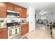 Open-concept kitchen featuring stainless steel appliances and seamless flow into the living area at 2213 Chandler Ranch Pl, Laughlin, NV 89029