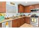 Bright kitchen featuring stainless steel appliances, granite countertops, and ample cabinet space at 2213 Chandler Ranch Pl, Laughlin, NV 89029