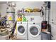 Washer and dryer along with shelving for convenient laundry storage at 2213 Chandler Ranch Pl, Laughlin, NV 89029