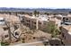 Aerial view of the residential area with multiple homes featuring tile roofs, desert landscaping, and mountain views at 2232 Aspen Mirror Way # 202, Laughlin, NV 89029