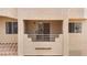 A close-up of a charming balcony with beige stucco walls and wrought iron railings, perfect for relaxing outdoors at 2232 Aspen Mirror Way # 202, Laughlin, NV 89029