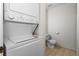 This efficient stacked laundry and half-bathroom combo offers convenience with a compact toilet and in-unit laundry facilities at 2232 Aspen Mirror Way # 202, Laughlin, NV 89029