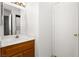 Functional bathroom area with a traditional vanity, sink, and a connecting door to the adjacent laundry area at 2232 Aspen Mirror Way # 202, Laughlin, NV 89029