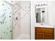 Bright bathroom featuring a shower with decorative tile accents and a vanity with ample counter space at 2232 Aspen Mirror Way # 202, Laughlin, NV 89029