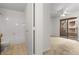 Bedroom with en-suite bathroom and door leading to outdoor patio at 2232 Aspen Mirror Way # 202, Laughlin, NV 89029